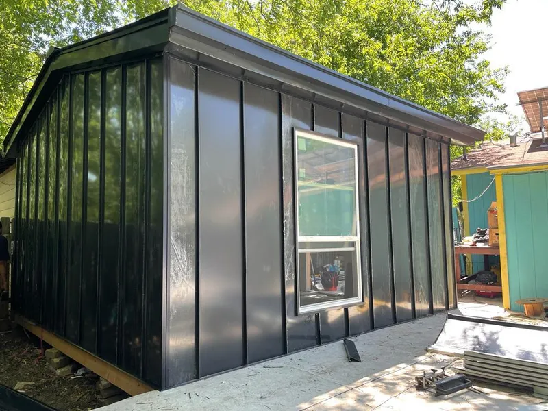 Black standing seam metal wall panels for Metal Roof Installation in Wolfeboro