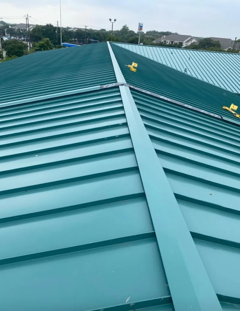 Green commercial metal roof ridge and valley for Metal Roof Repair in Wolfeboro
